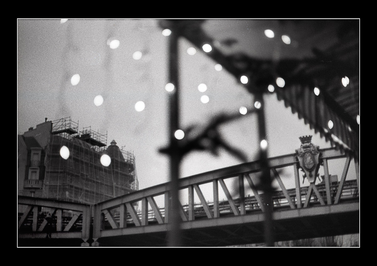 Moody black and white photo Paris overground metro Photo Oleg Sotnik