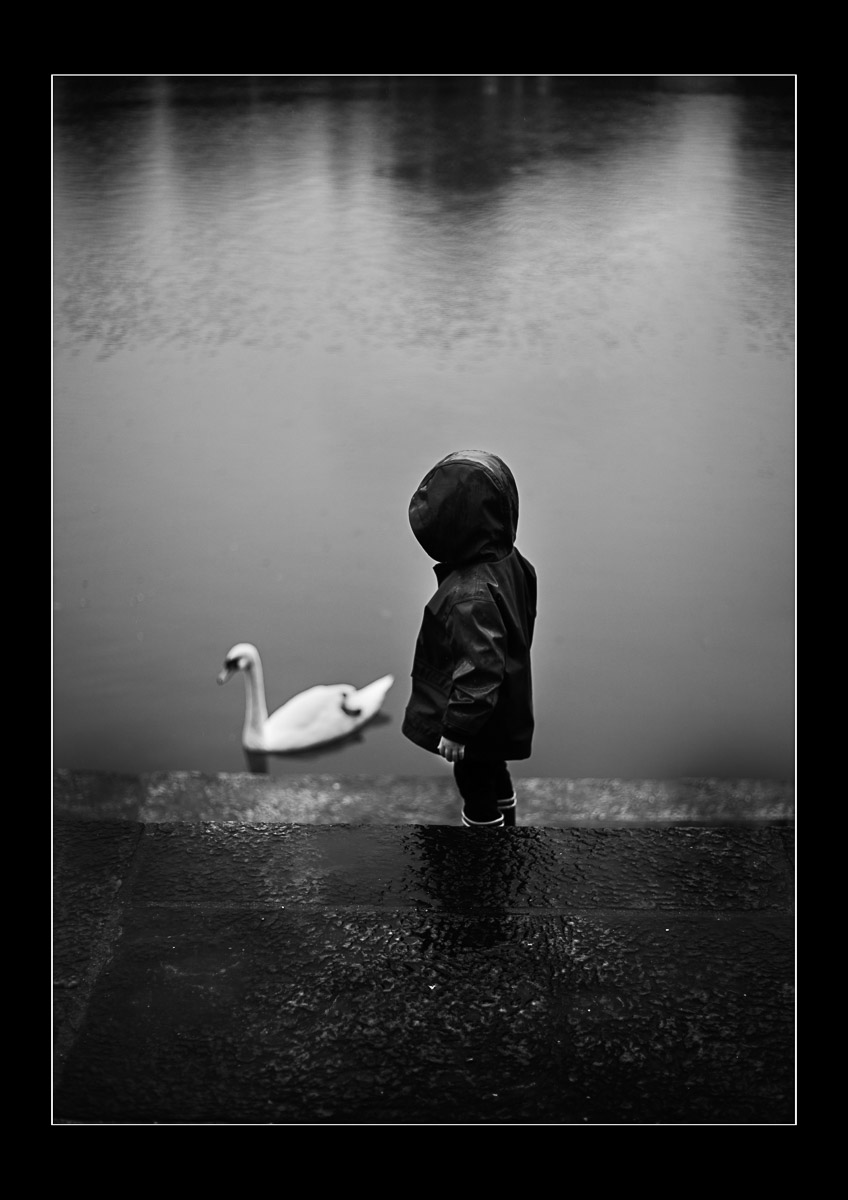 Moody black and white photo The Child and the Swan Photo Oleg Sotnik